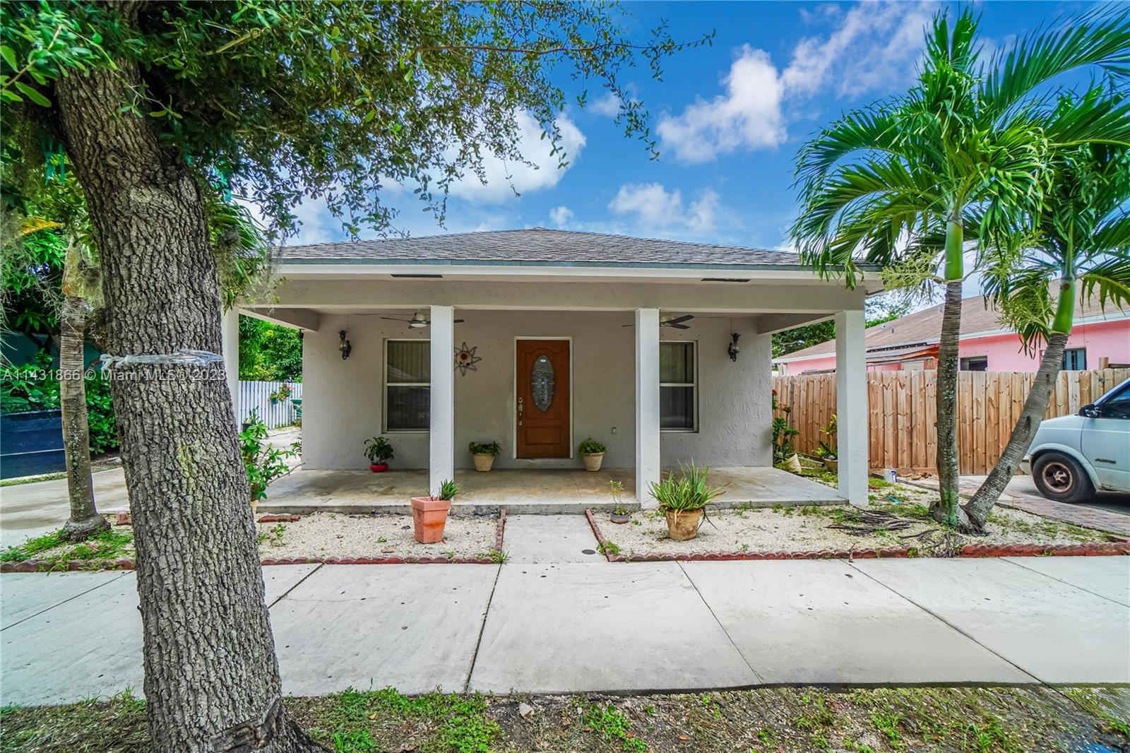 24313 Southwest 130th Avenue Homestead, FL 33032 - Photo 2 of 23 a front view of a house with garden