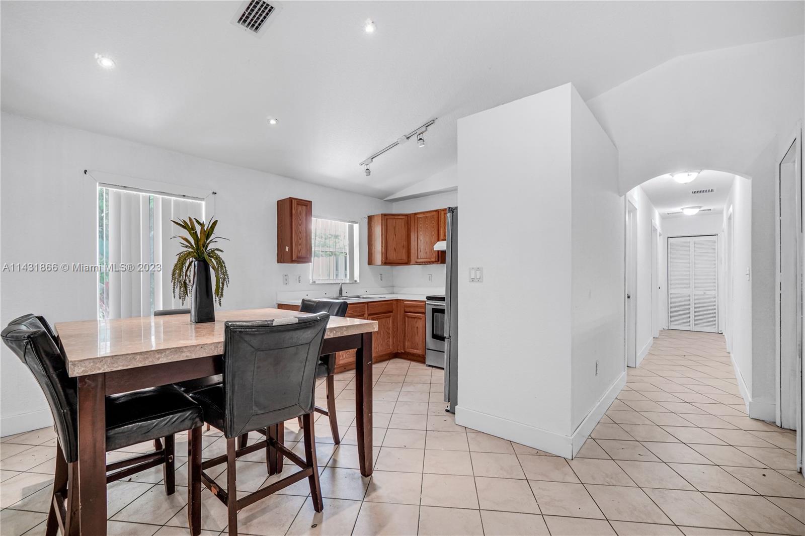 24313 Southwest 130th Avenue Homestead, FL 33032 - Photo 5 of 23 a dining room with furniture and window