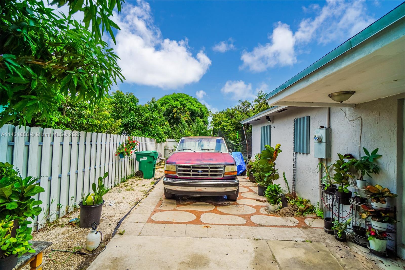 24313 Southwest 130th Avenue Homestead, FL 33032 - Photo 7 of 23 a house with a garden space