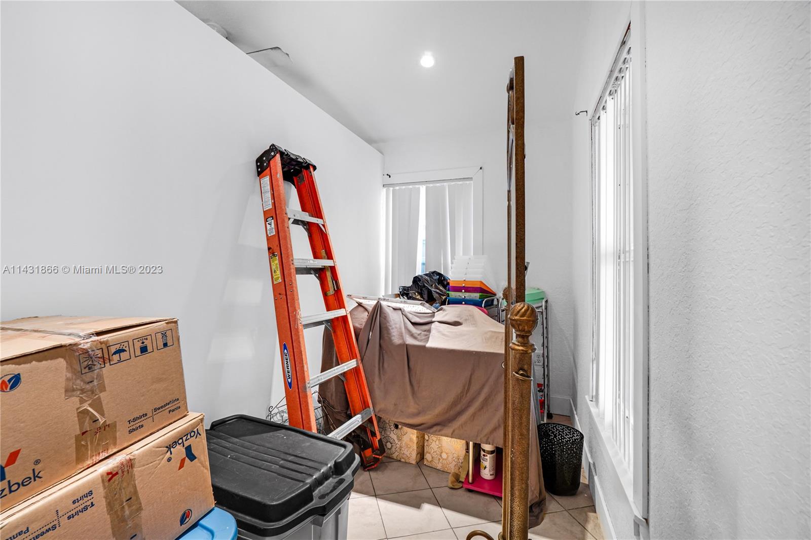 24313 Southwest 130th Avenue Homestead, FL 33032 - Photo 10 of 23 a view of a room with gym equipment