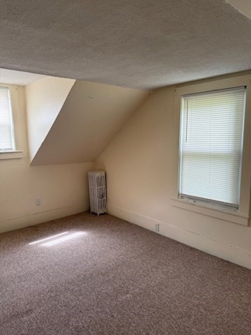 113 West Main Street, Unit 113 Ayer, MA 01432 - Photo 8 of 17 a view of an empty room with a window