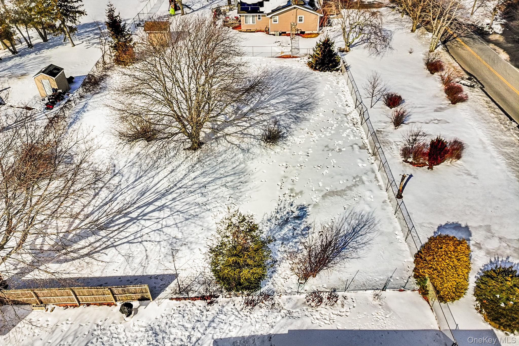 257 Doctors Path Riverhead, NY 11901 - Photo 2 of 18 a backyard of a house