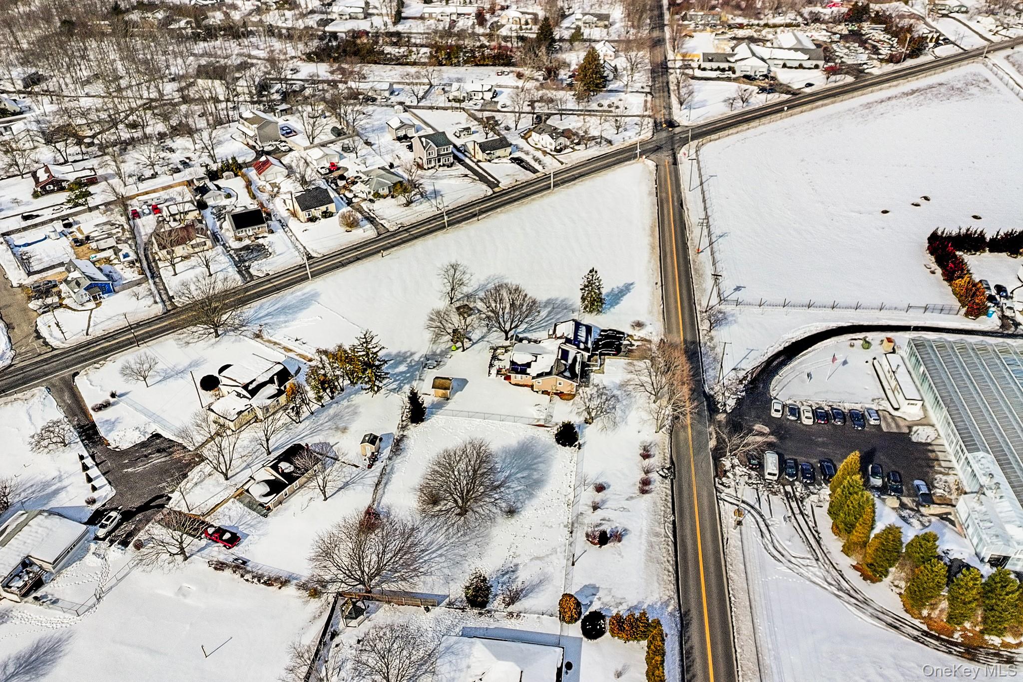 257 Doctors Path Riverhead, NY 11901 - Photo 8 of 18 an aerial view of a swimming pool with outdoor seating