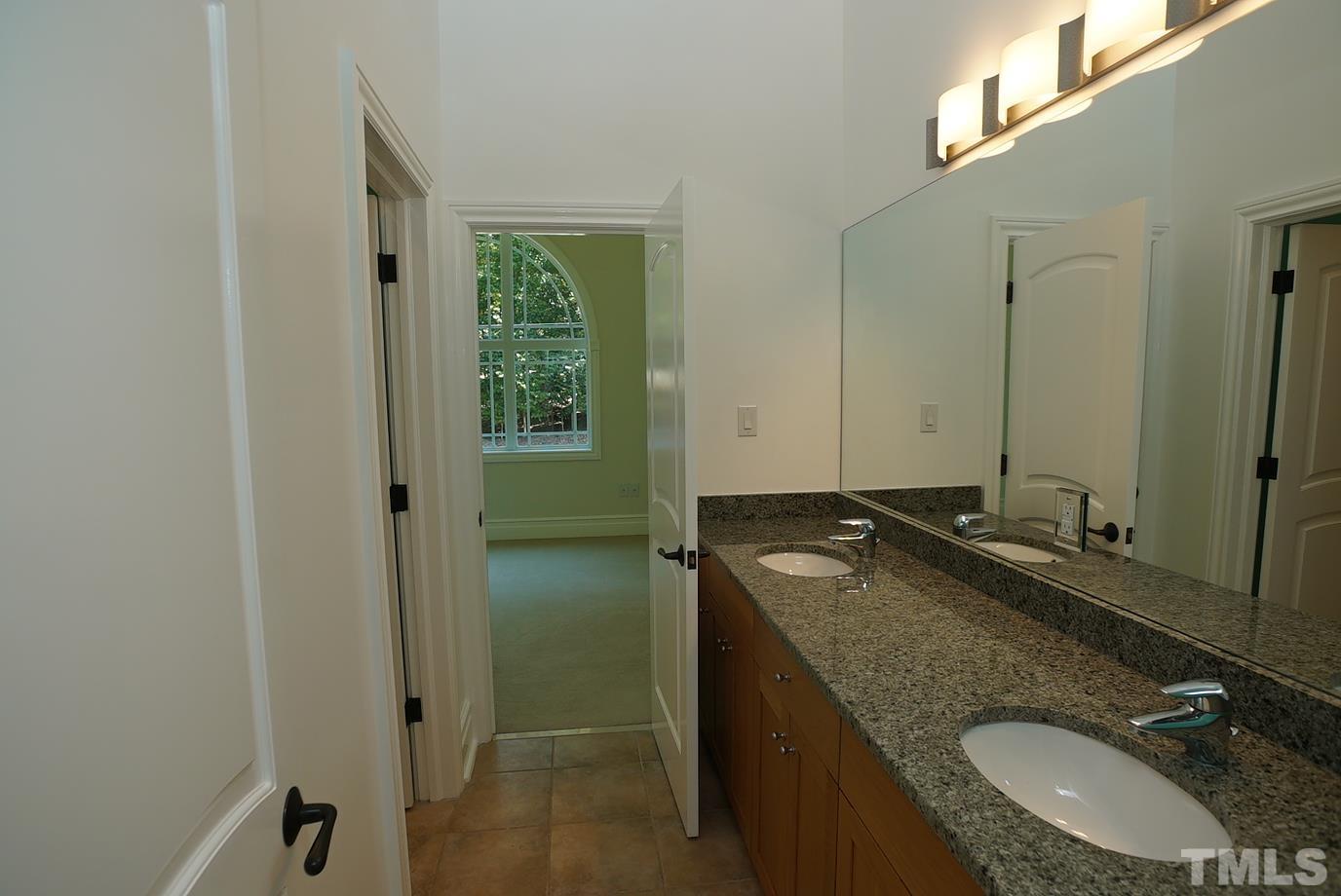 6007 Graystone Drive Chapel Hill, NC 27514 - Photo 14 of 30 Secondary bath with granite counter and tile flooring.