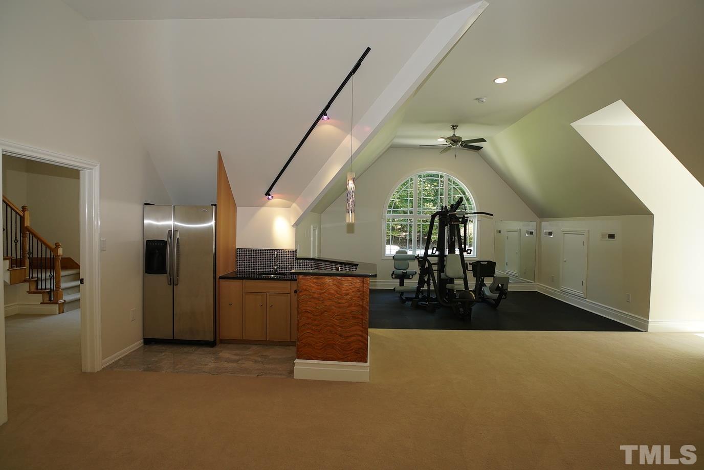 6007 Graystone Drive Chapel Hill, NC 27514 - Photo 17 of 30 Workout/rec room with kitchenette is located on the second floor adjacent to the bonus room.