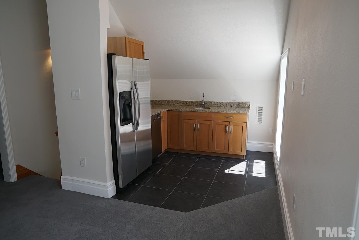 6007 Graystone Drive Chapel Hill, NC 27514 - Photo 20 of 30 Third floor kitchenette is adjacent to the home theatre.
