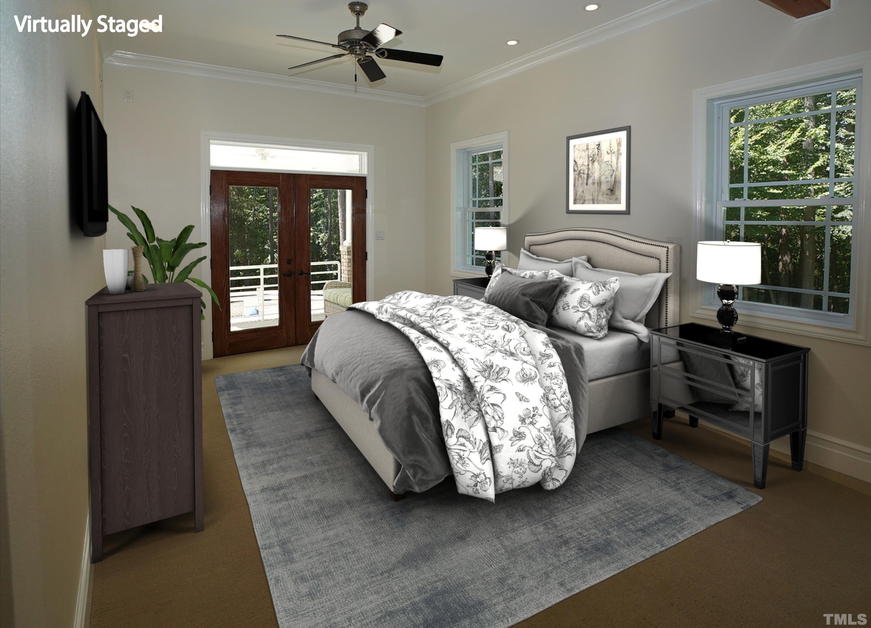 6007 Graystone Drive Chapel Hill, NC 27514 - Photo 5 of 30 Main-level primary bedroom with French doors to private balcony and pool area.