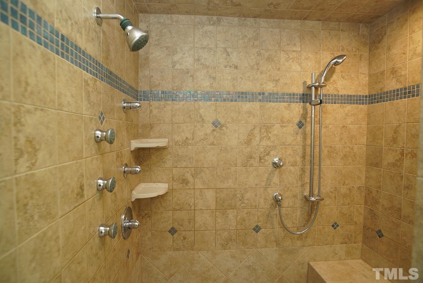 6007 Graystone Drive Chapel Hill, NC 27514 - Photo 8 of 30 Steam shower with multiple shower heads/jets and a seat.