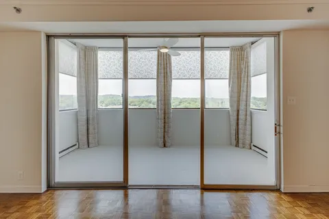 a view of an empty room and window