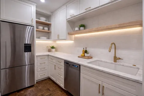 a kitchen with a refrigerator and a sink