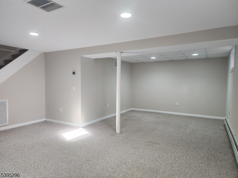 84 Reservoir Avenue Butler, NJ 07405 - Photo 16 of 20 an empty room with windows