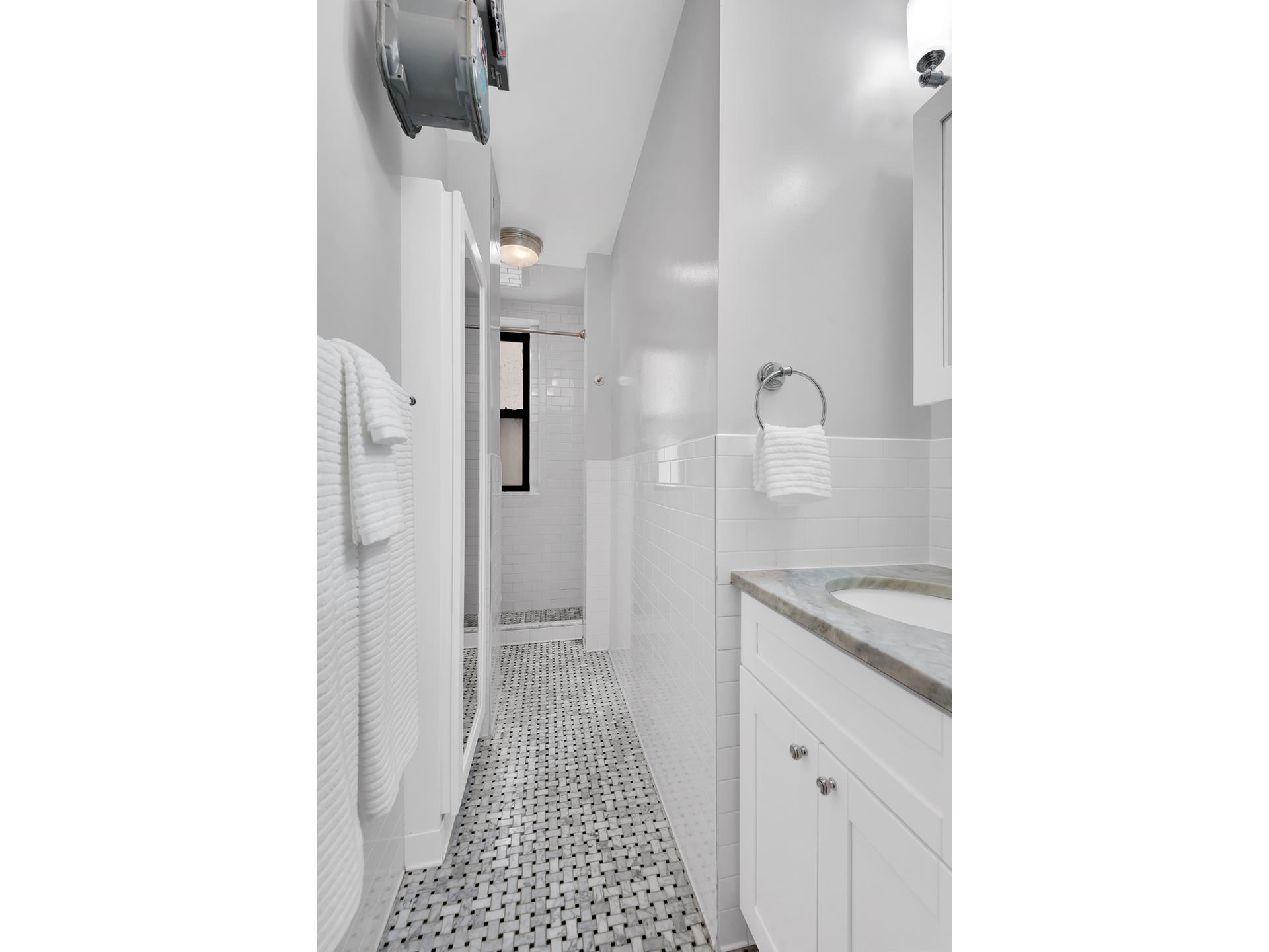 375 Riverside Drive, Unit 7G Manhattan, NY 10025 - Photo 3 of 7 a bathroom with a sink and a mirror