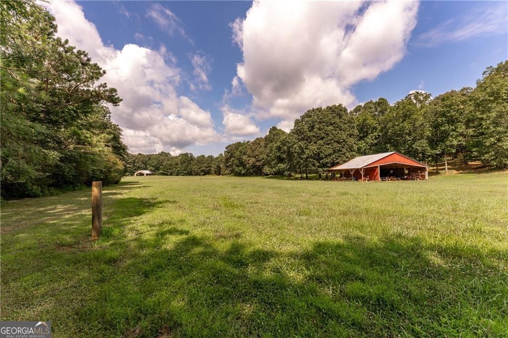 1158 Bailey Road Aragon, GA 30104 - Photo 67 of 73 a blue swimming pool is in the middle of a lake
