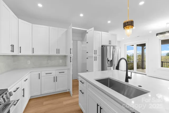 a view of a room with rack on the wall and a window