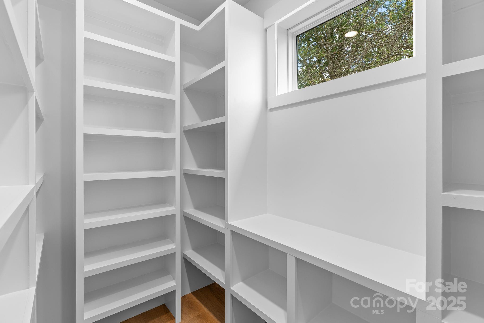 1148 Alexander Road Leicester, NC 28748 - Photo 18 of 47 a view of a room with rack on the wall and a window