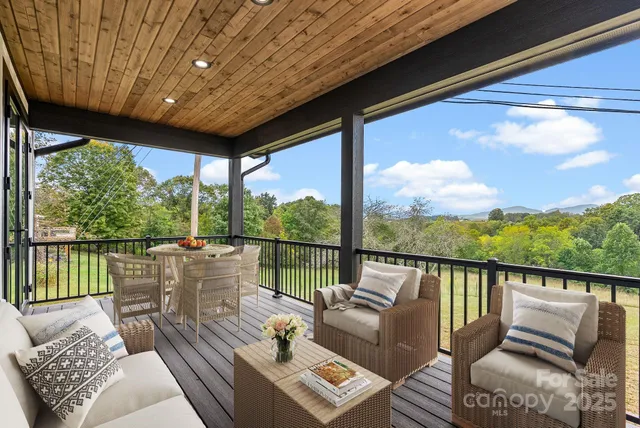 a view of balcony with wooden floor