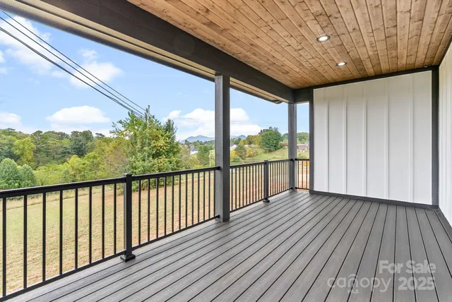 a bed room with a bed and a chandelier