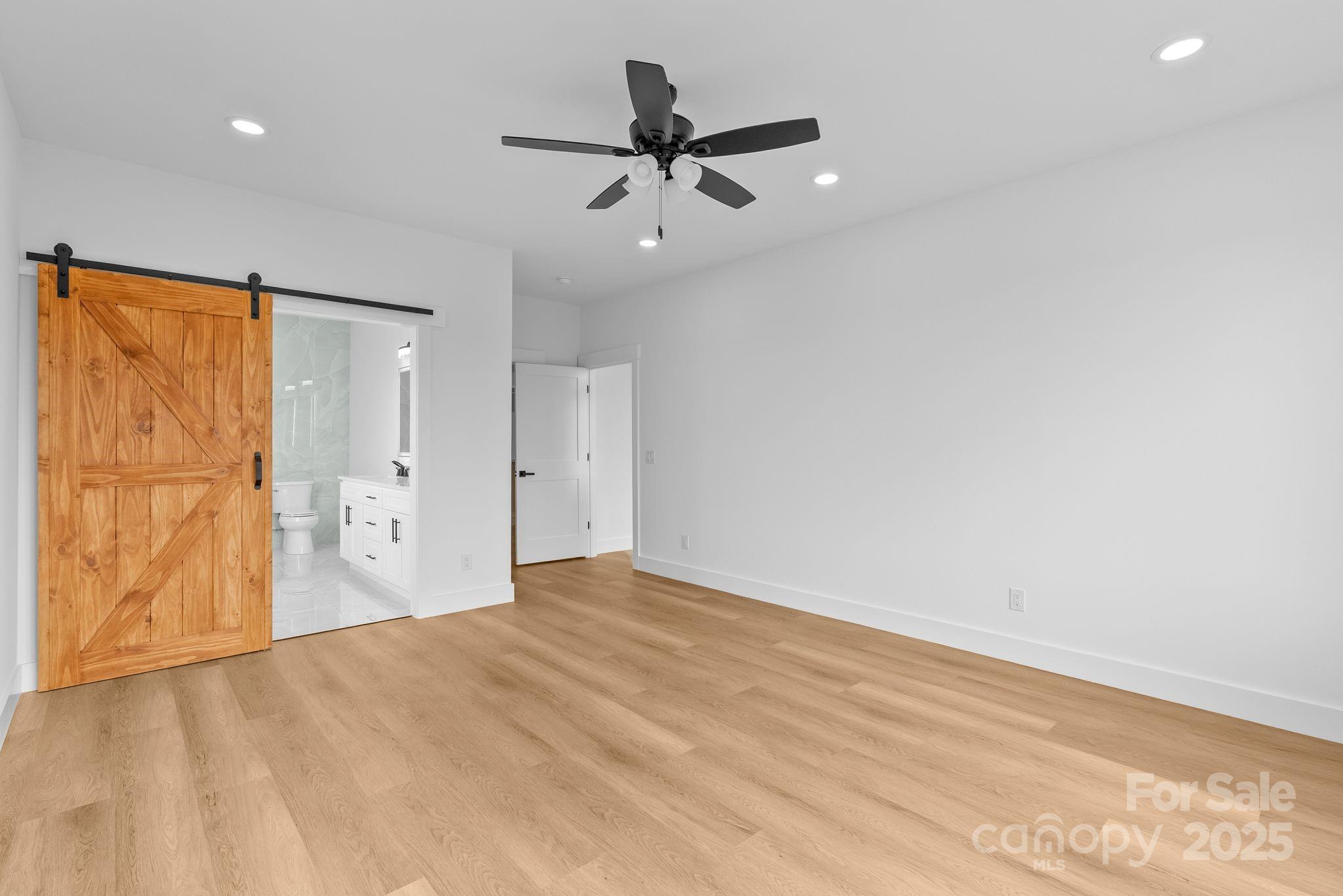1148 Alexander Road Leicester, NC 28748 - Photo 24 of 47 wooden floor in an empty room with a window