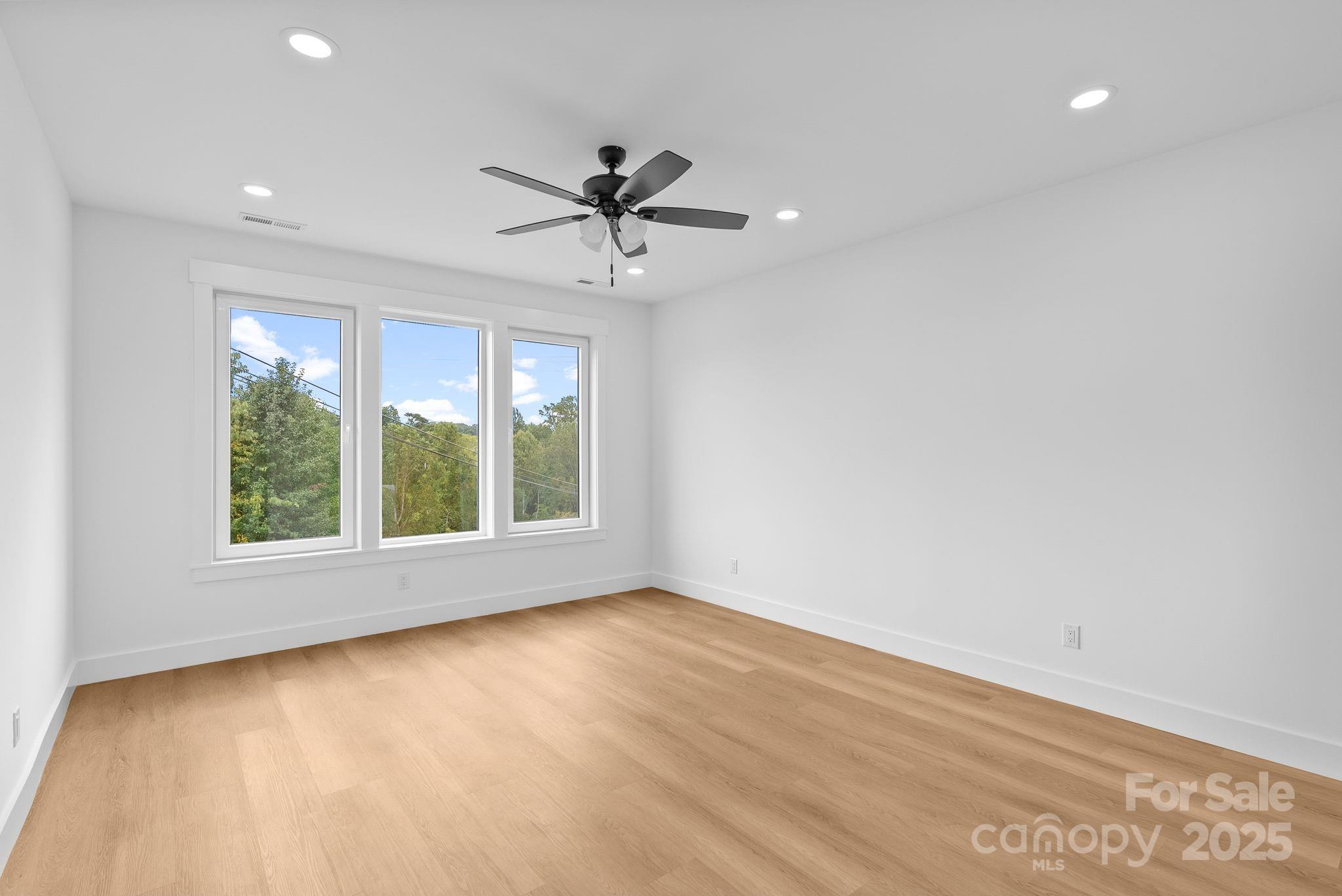 1148 Alexander Road Leicester, NC 28748 - Photo 32 of 47 wooden floor in an empty room with a window