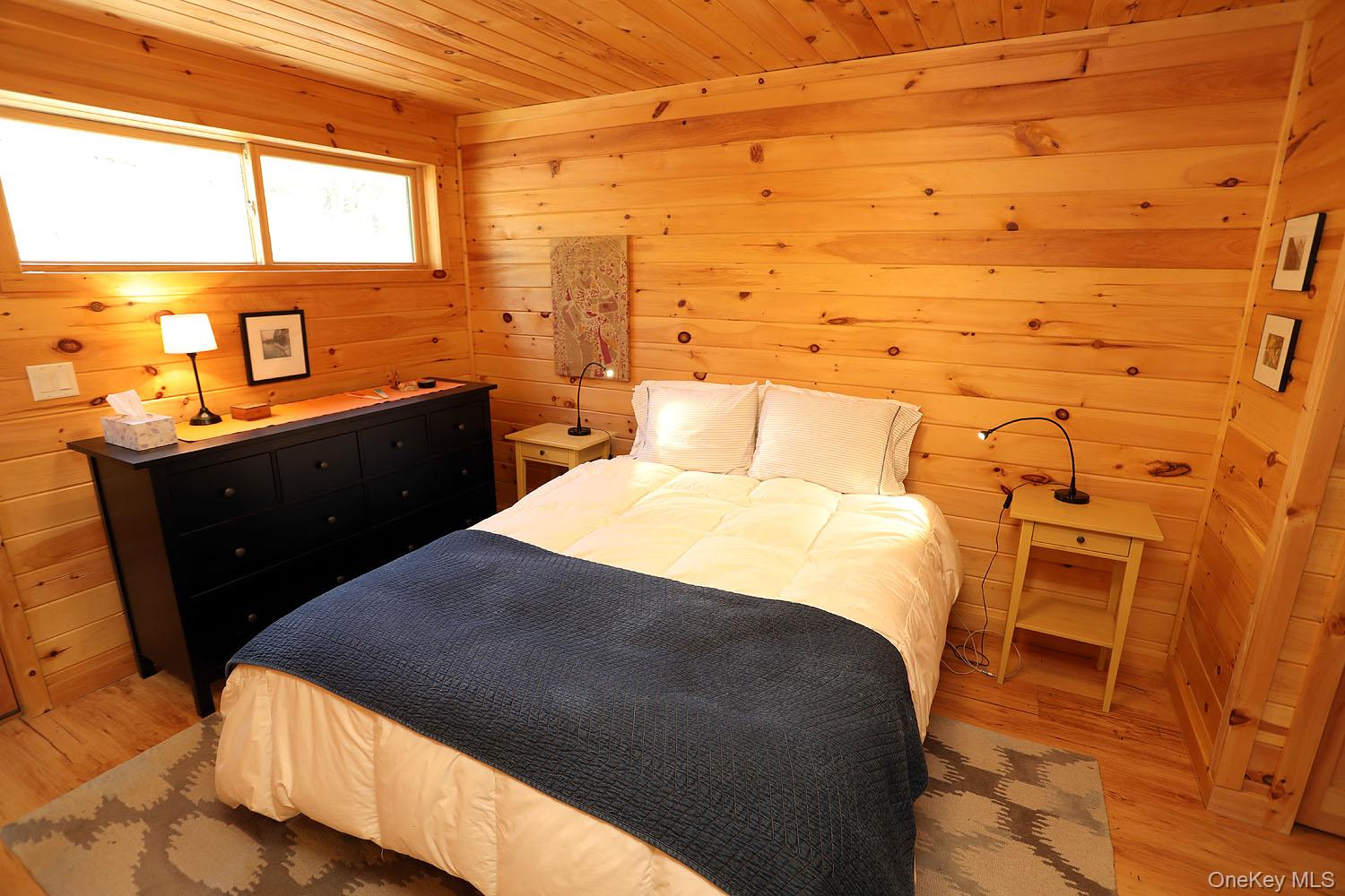 5120 Peas Eddy Road Hancock, NY 13783 - Photo 22 of 37 a bedroom with a bed and wooden floor