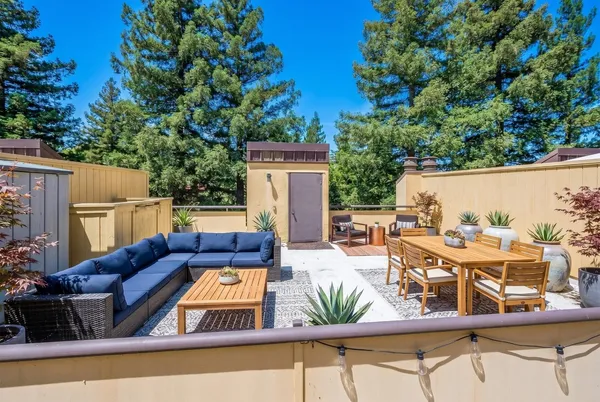 swimming pool view with a seating space