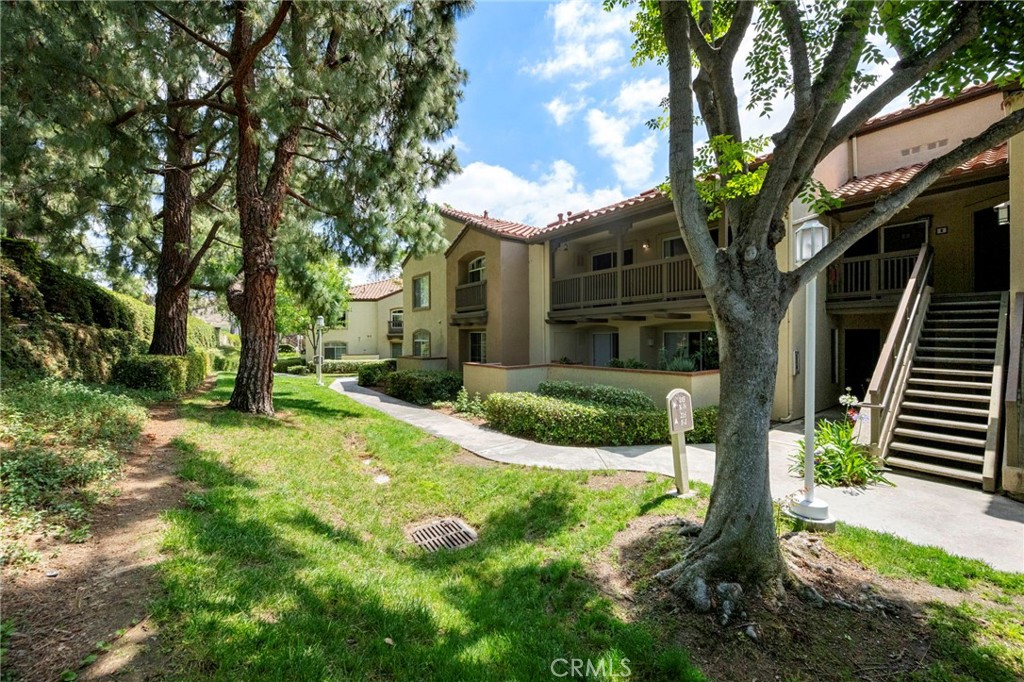 215 South Cross Creek Road, Unit L Orange, CA 92869 - Photo 3 of 50 a front view of a house with garden