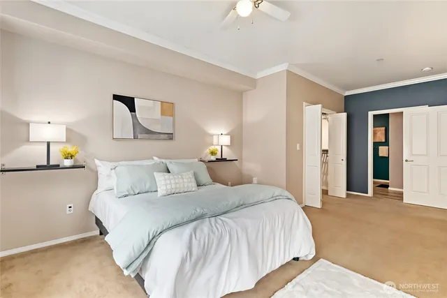 a bedroom with a bed and a lamp