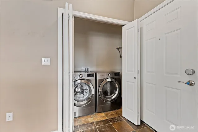 a utility room with dryer and washer
