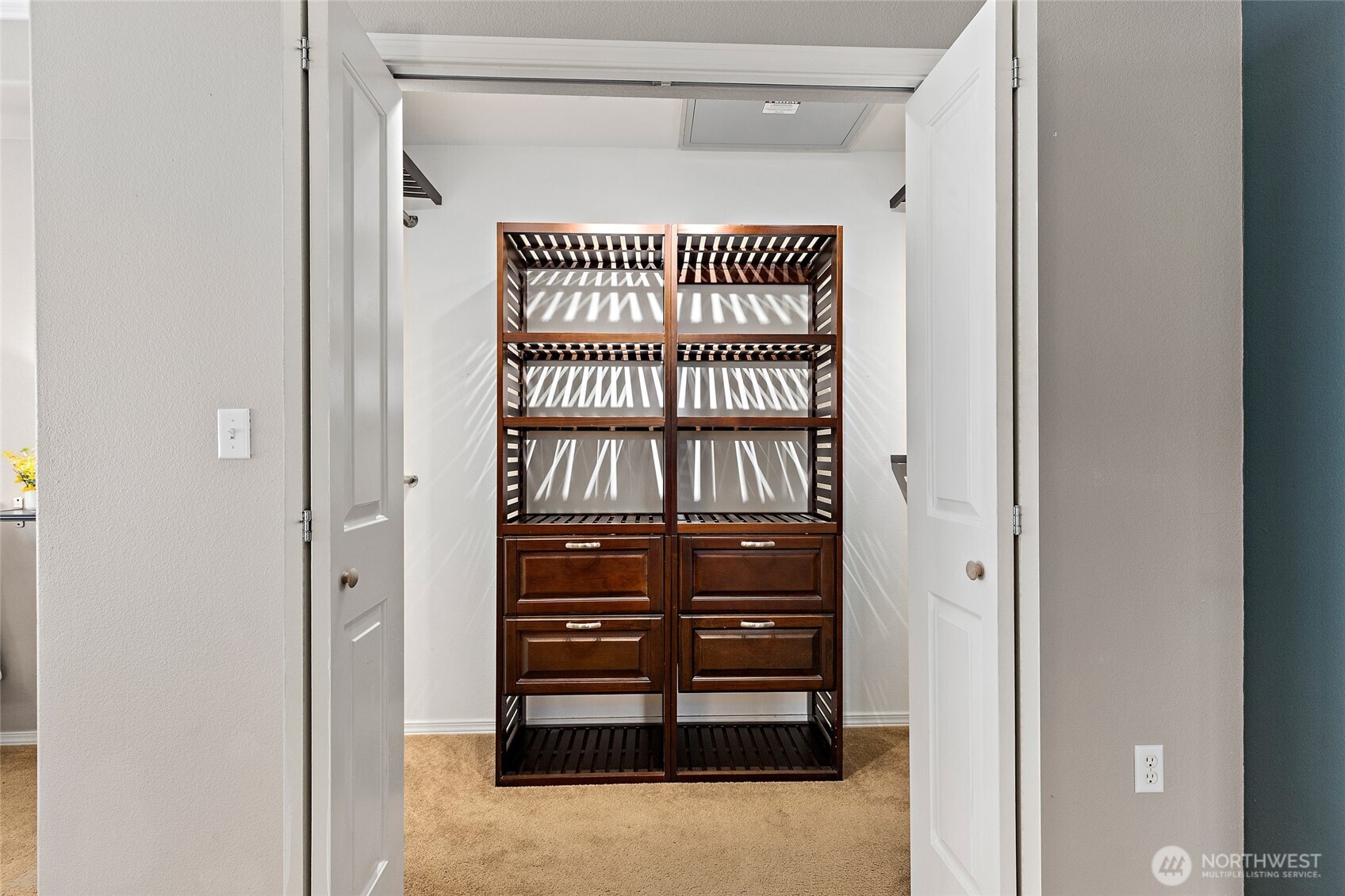 14915 38th Drive Southeast, Unit 2049 Bothell, WA 98012 - Photo 16 of 36 a view of walk in closet with clothes