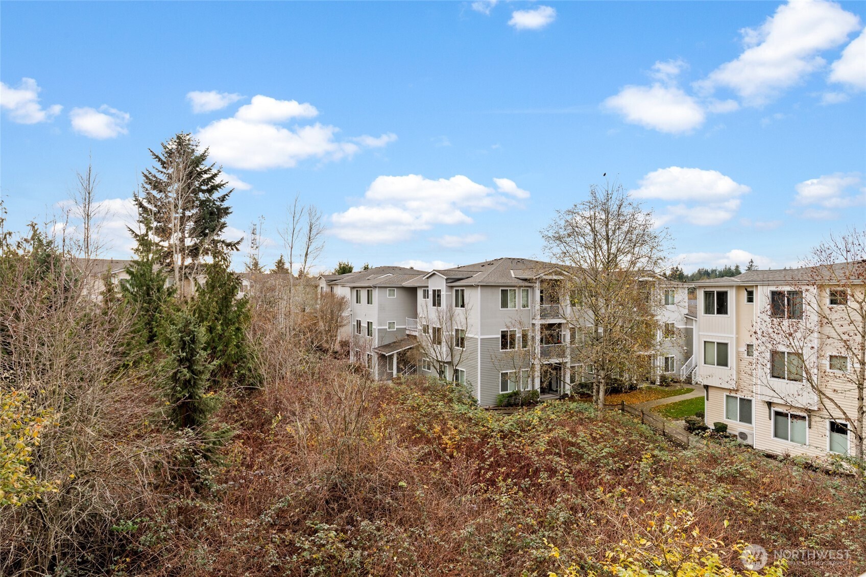 14915 38th Drive Southeast, Unit 2049 Bothell, WA 98012 - Photo 25 of 36 a view of a house with a backyard