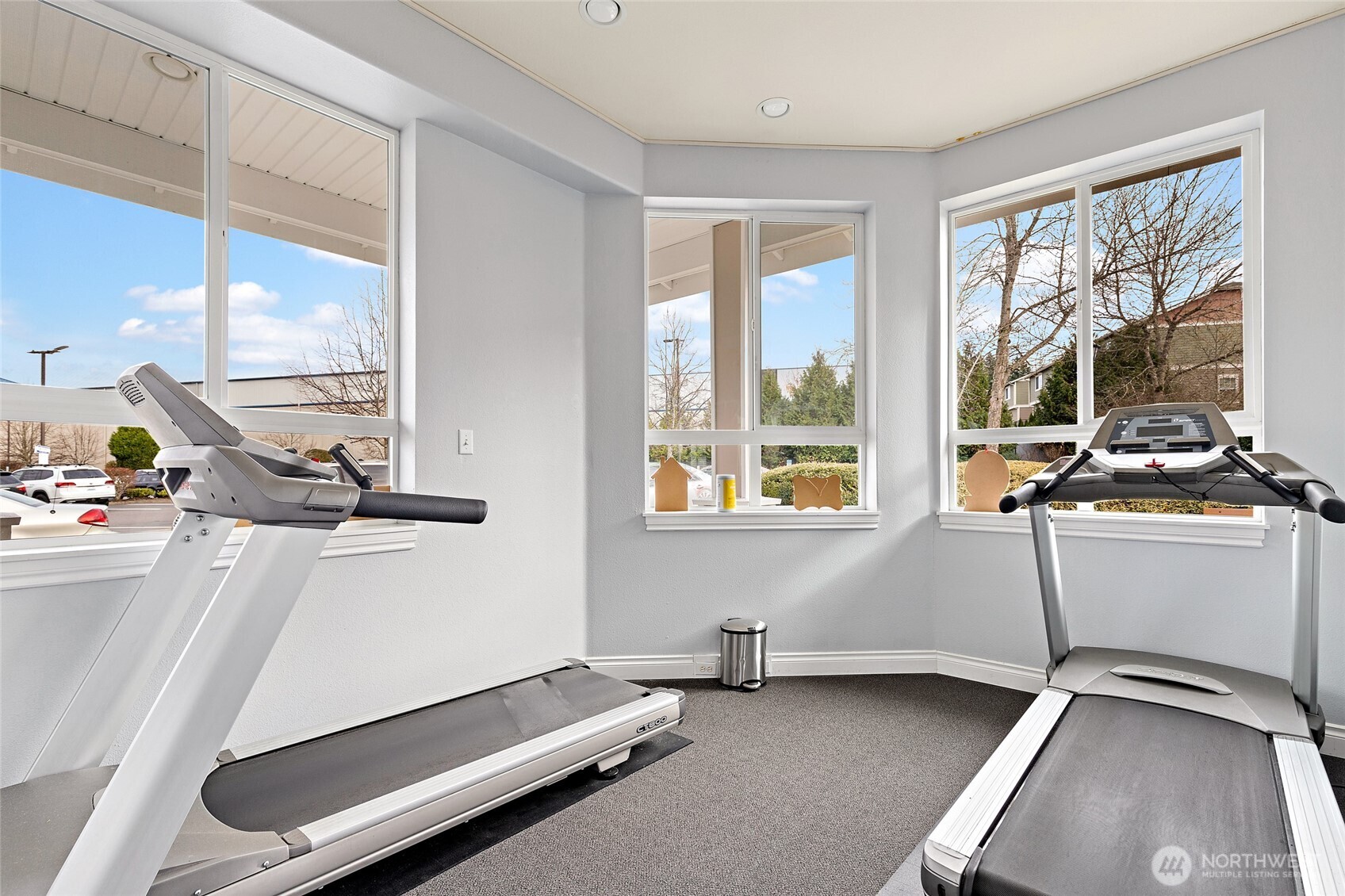 14915 38th Drive Southeast, Unit 2049 Bothell, WA 98012 - Photo 31 of 36 a room with gym equipment and a large window