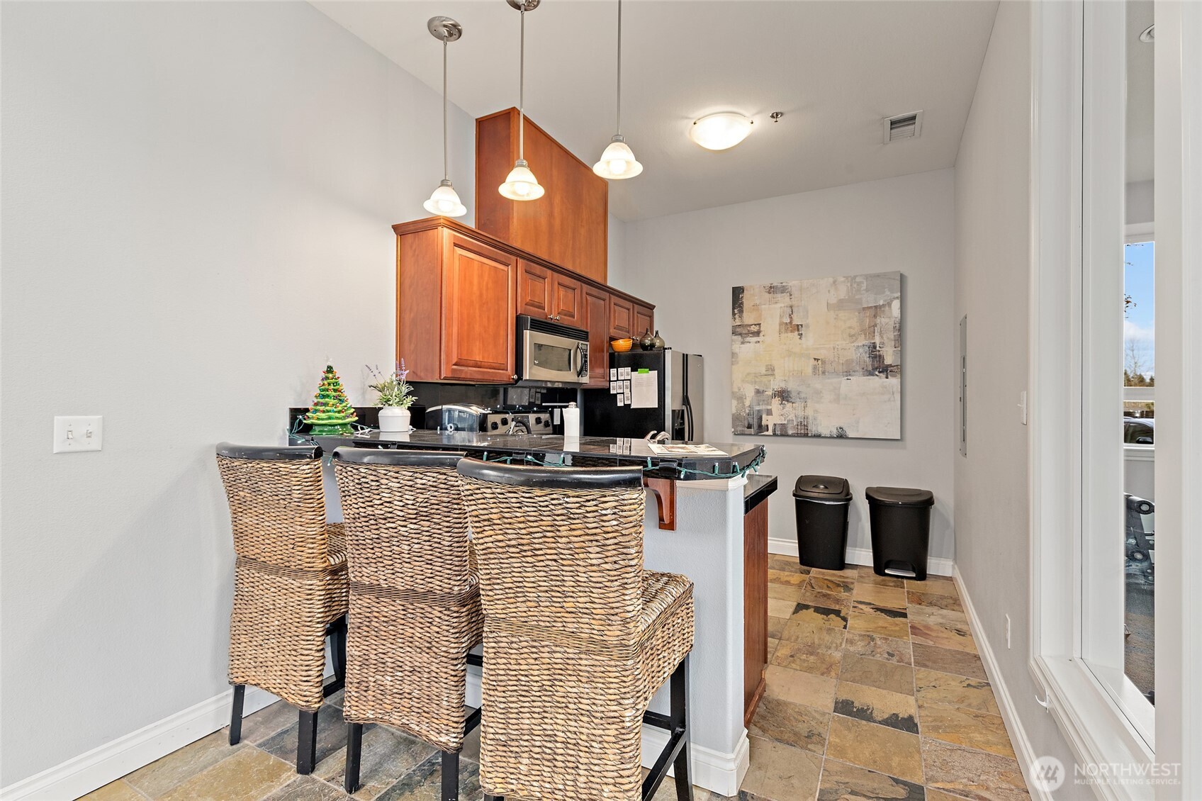 14915 38th Drive Southeast, Unit 2049 Bothell, WA 98012 - Photo 34 of 36 a kitchen with a table and chairs in it