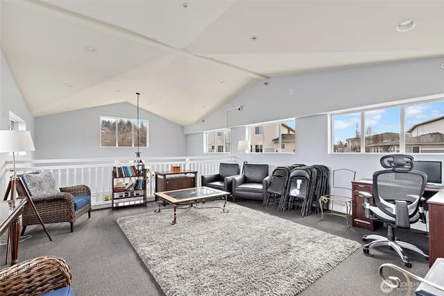 a living room with furniture gym equipment and view of living room