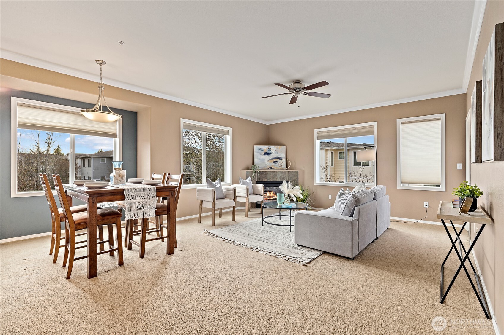 14915 38th Drive Southeast, Unit 2049 Bothell, WA 98012 - Photo 4 of 36 a living room with furniture a chandelier and a large window