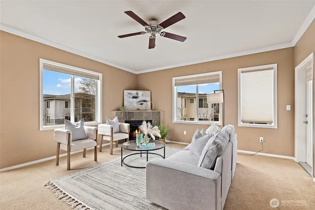 a living room with furniture and a large window