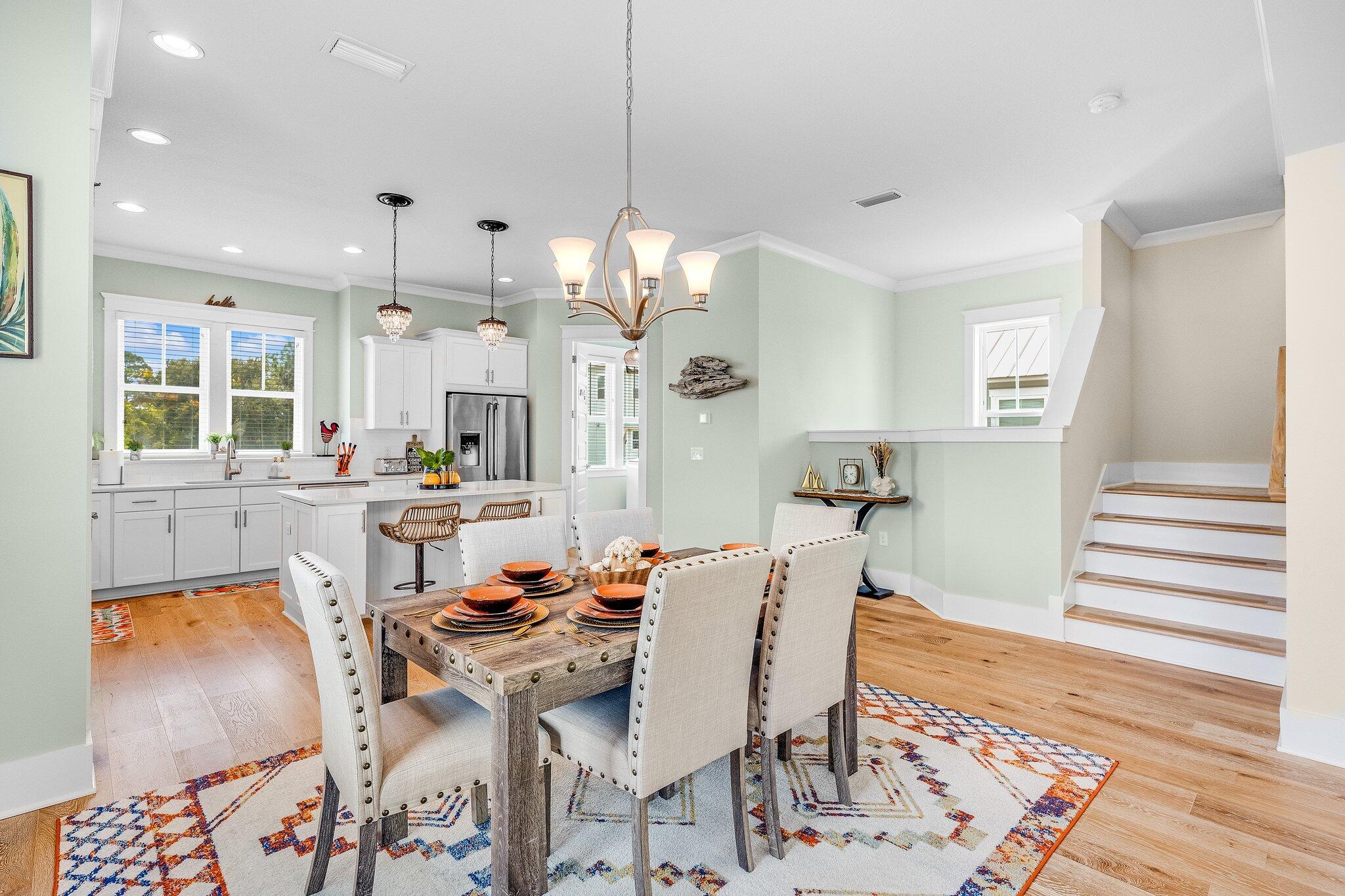 79 Grande Pointe Drive Inlet Beach, FL 32461 - Photo 17 of 47 a view of a dining room with furniture and wooden floor