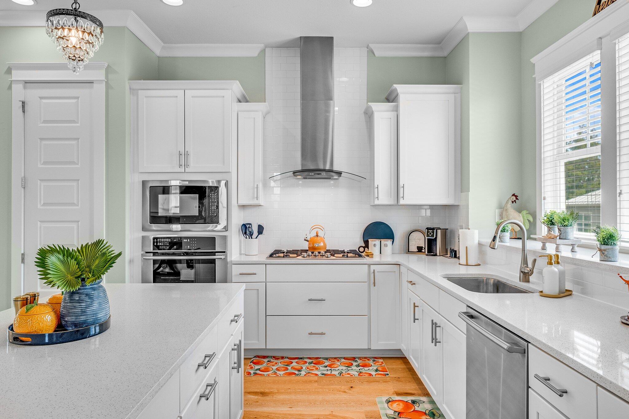 79 Grande Pointe Drive Inlet Beach, FL 32461 - Photo 22 of 47 a kitchen with stainless steel appliances a sink a white counter space and a window