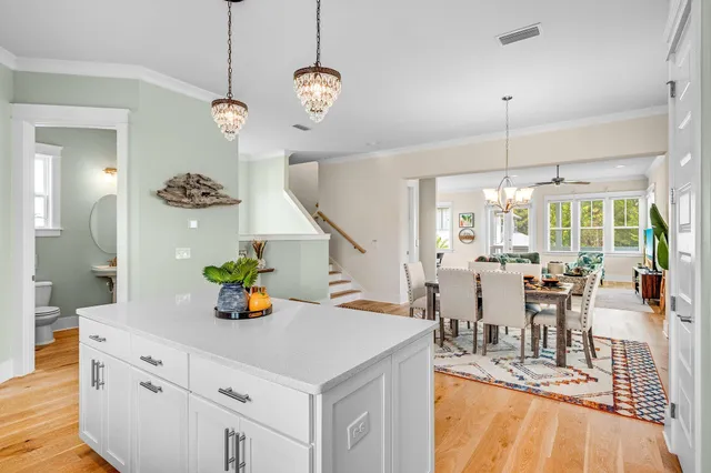 a view of a chair and tables in the balcony