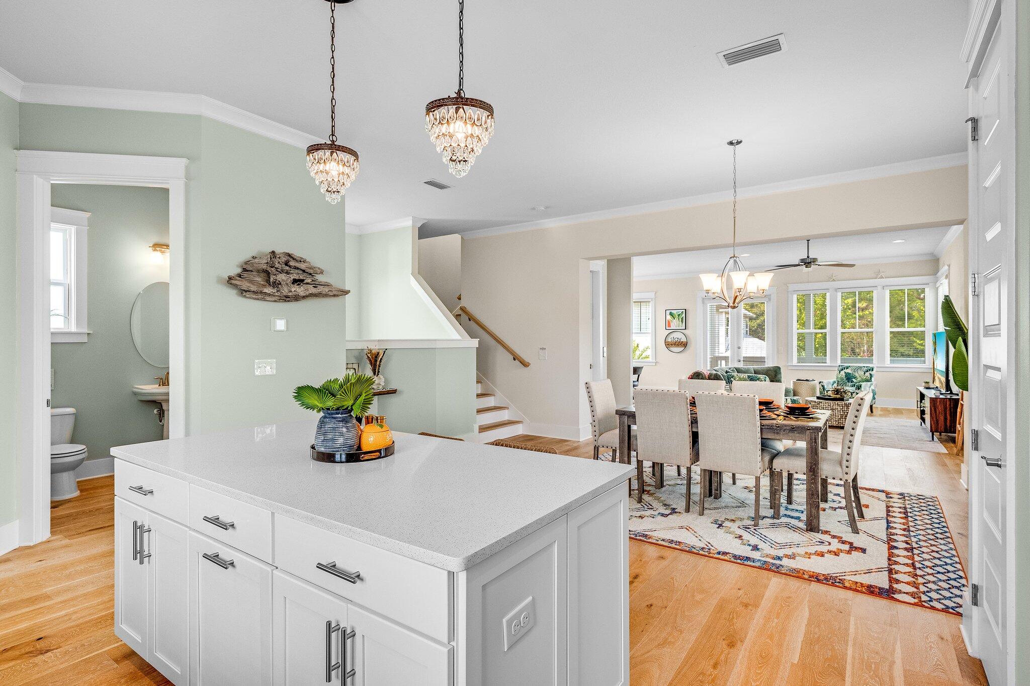 79 Grande Pointe Drive Inlet Beach, FL 32461 - Photo 24 of 47 a view of dining room and livingroom with furniture wooden floor a chandelier