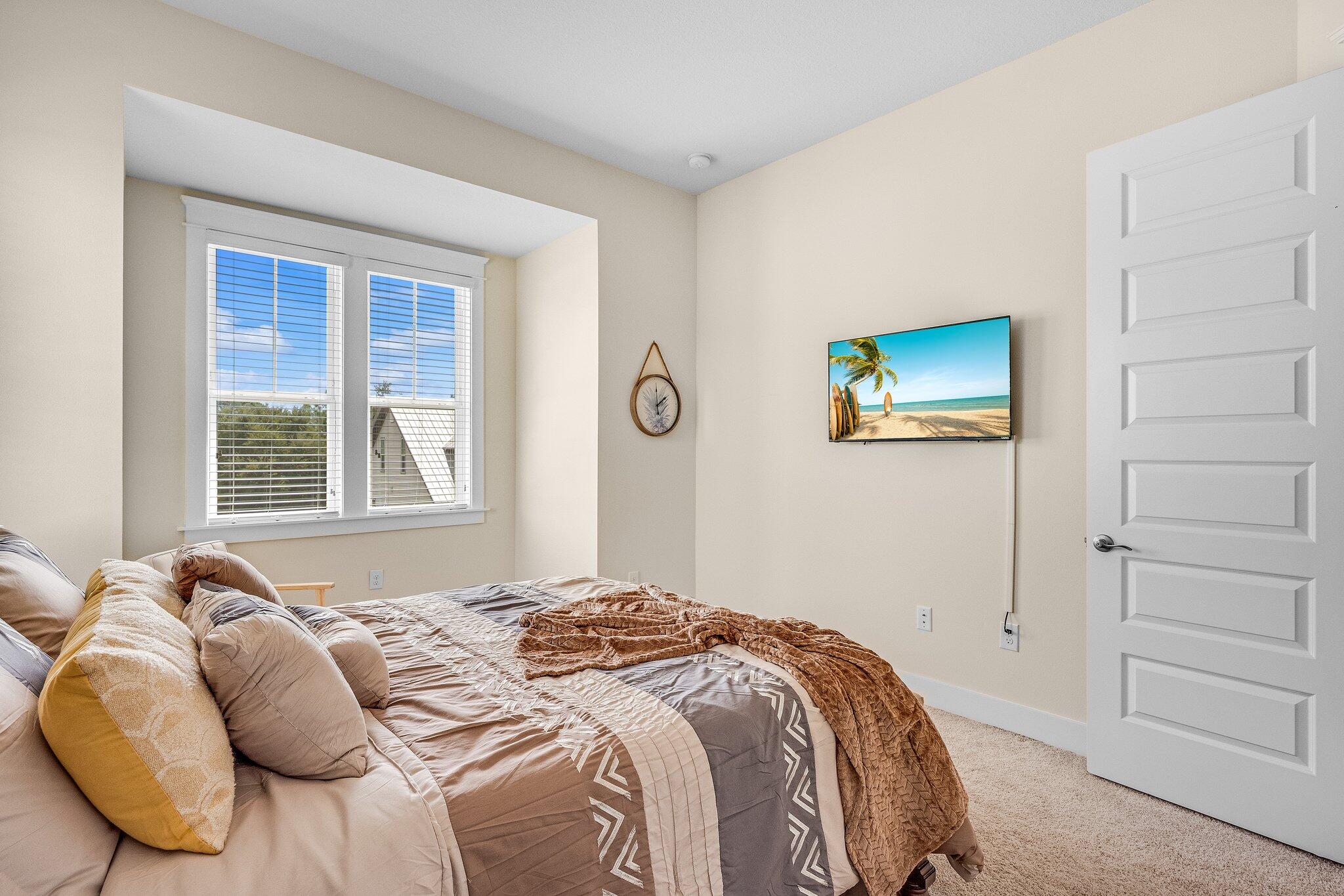 79 Grande Pointe Drive Inlet Beach, FL 32461 - Photo 29 of 47 a bedroom with a bed and a window