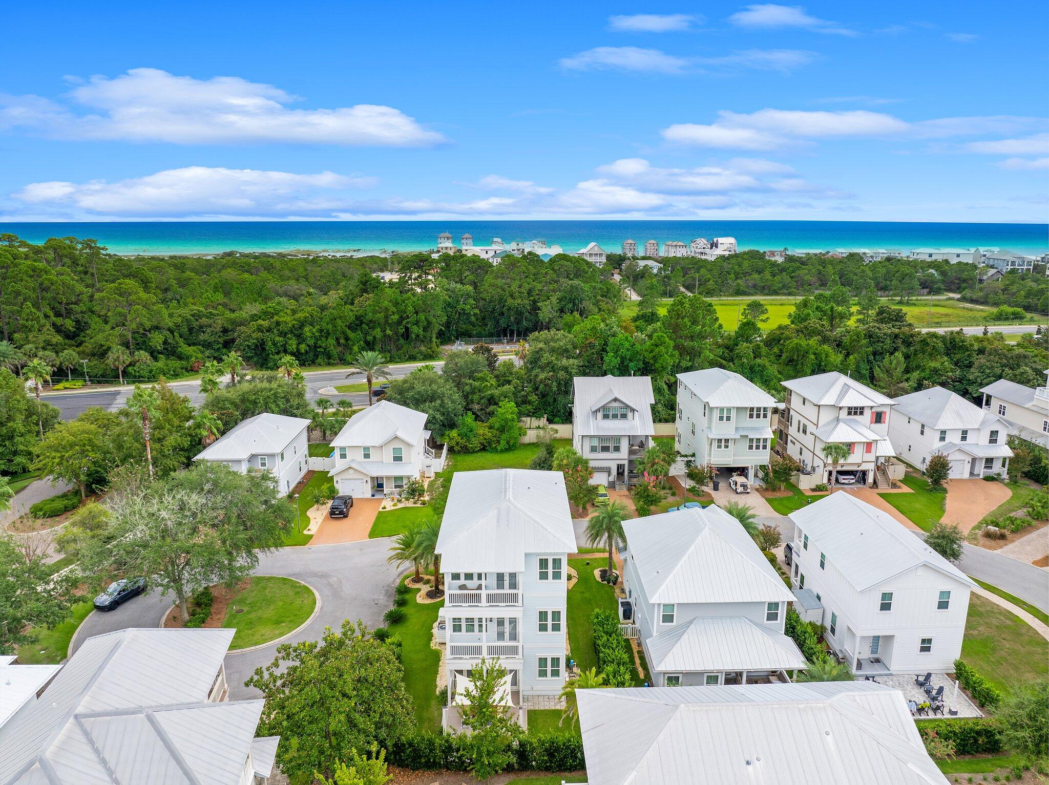 79 Grande Pointe Drive Inlet Beach, FL 32461 - Photo 47 of 47 an aerial view of a city with lots of residential buildings ocean and mountain view in back