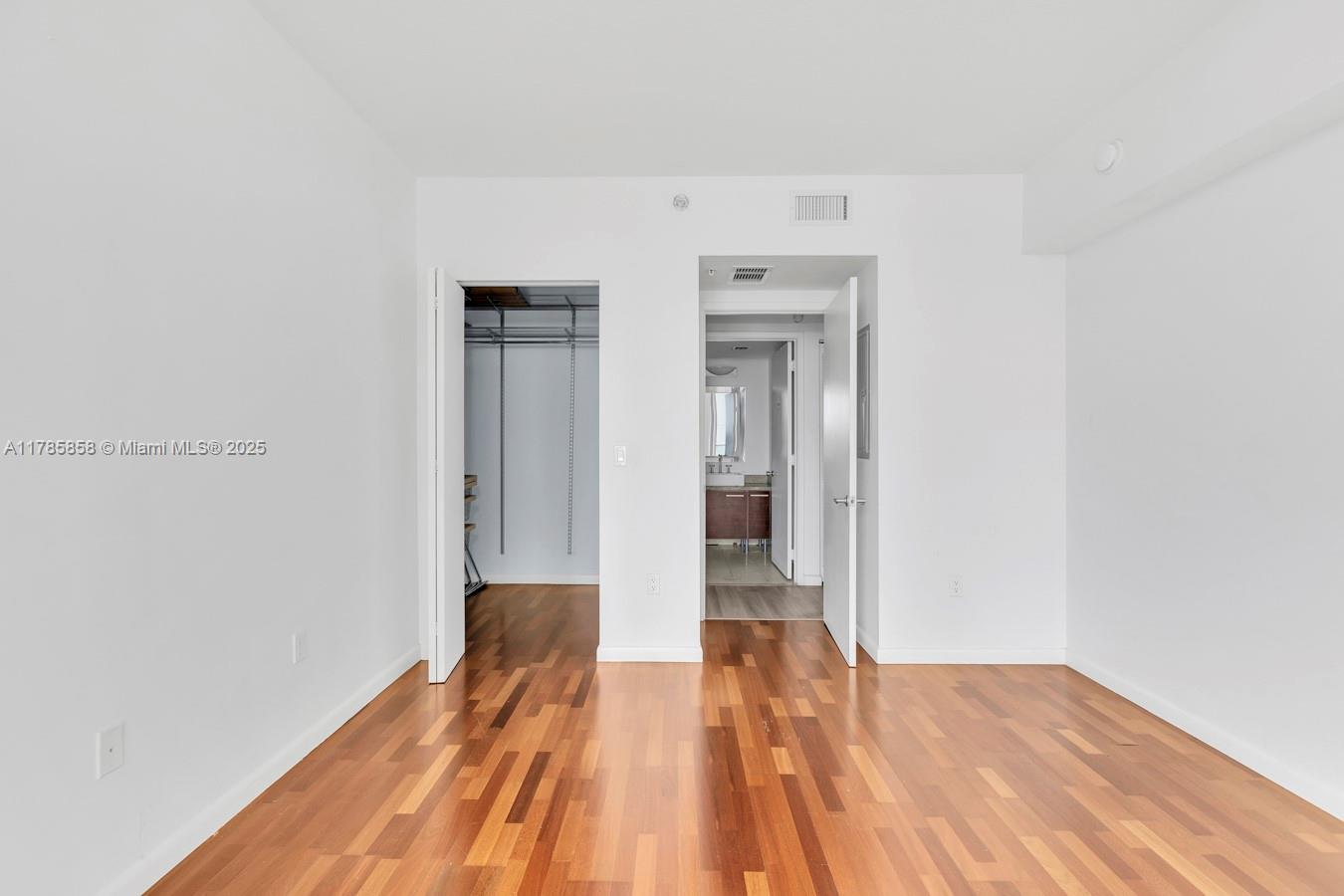 185 Southwest 7th Street, Unit 1508 Miami, FL 33130 - Photo 12 of 30 a view of a room with wooden floor