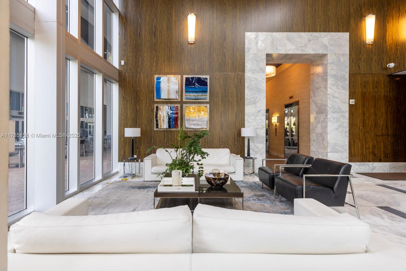 185 Southwest 7th Street, Unit 1508 Miami, FL 33130 - Photo 17 of 30 a living room with furniture and a potted plant