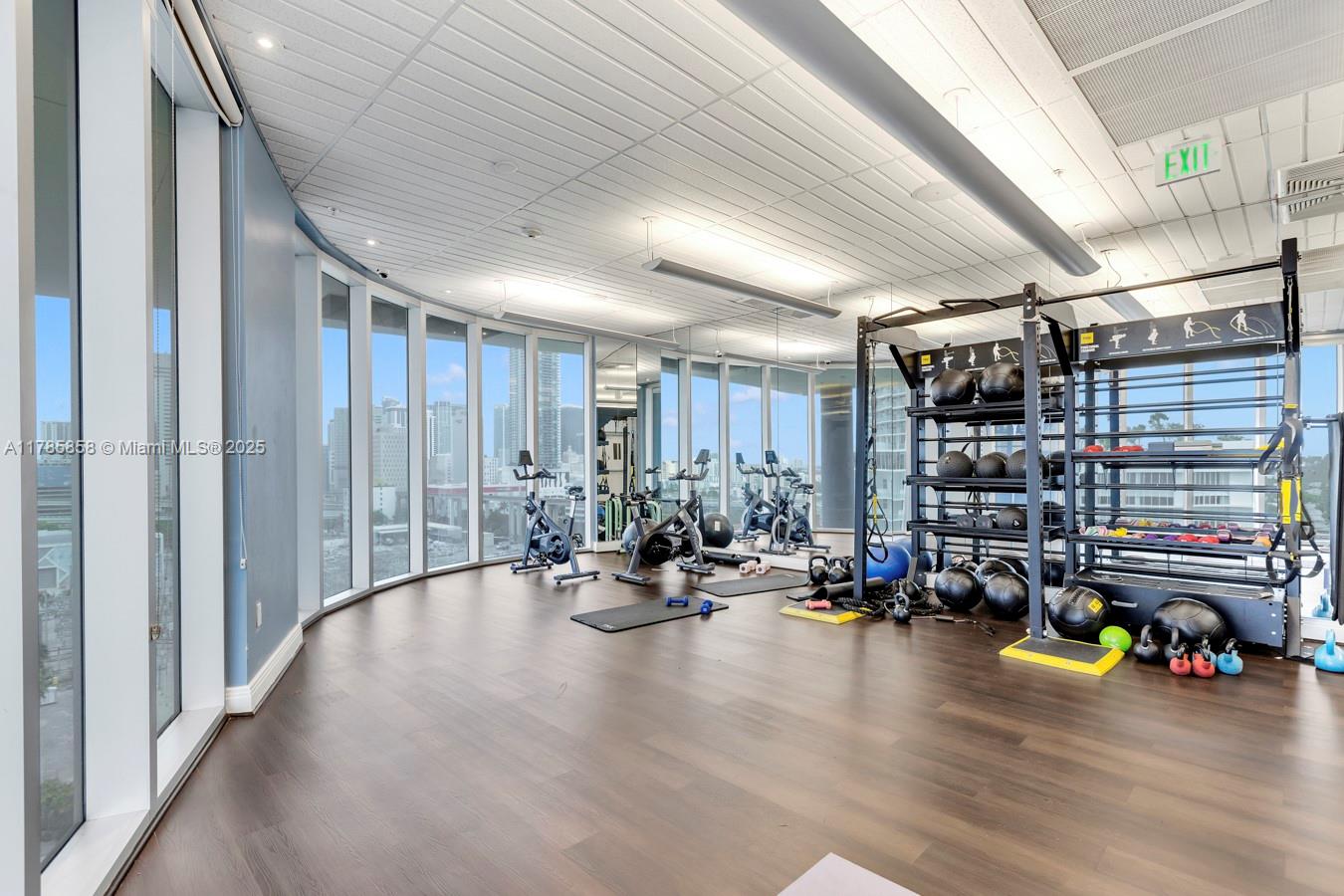 185 Southwest 7th Street, Unit 1508 Miami, FL 33130 - Photo 18 of 30 a view of a room with gym equipment