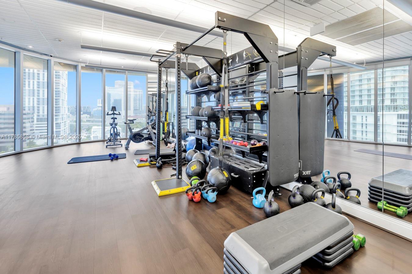 185 Southwest 7th Street, Unit 1508 Miami, FL 33130 - Photo 19 of 30 a view of a room with gym equipment