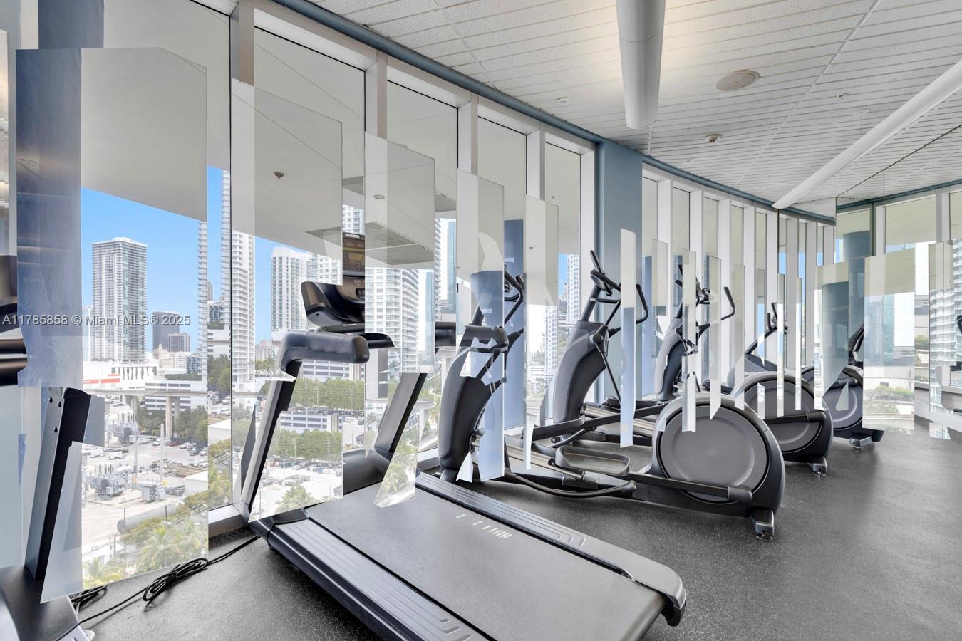 185 Southwest 7th Street, Unit 1508 Miami, FL 33130 - Photo 20 of 30 a view of a room with gym equipment