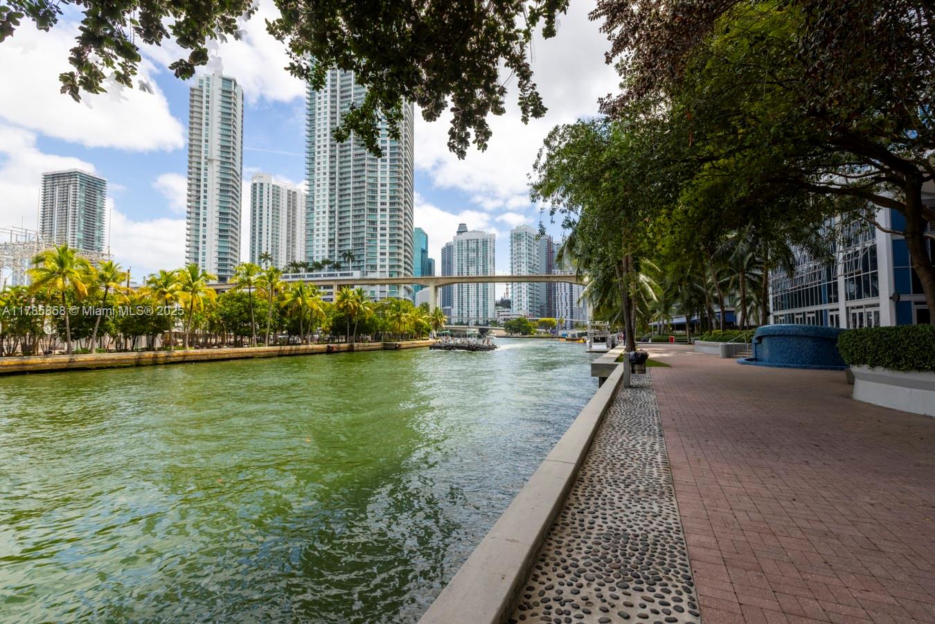 185 Southwest 7th Street, Unit 1508 Miami, FL 33130 - Photo 21 of 30 a view of swimming pool with outdoor seating and plants