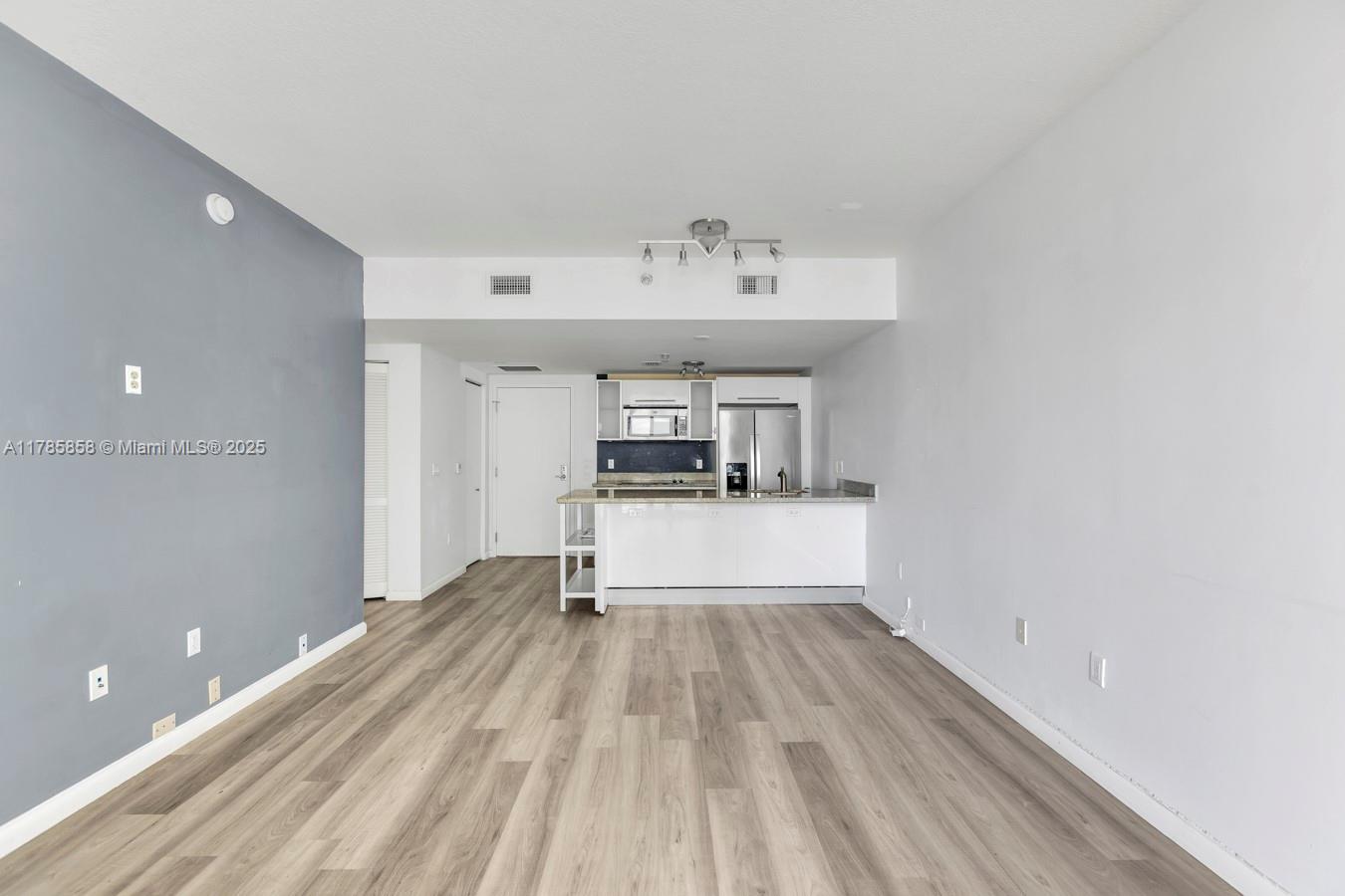 185 Southwest 7th Street, Unit 1508 Miami, FL 33130 - Photo 6 of 30 a view of livingroom with furniture and wooden floor