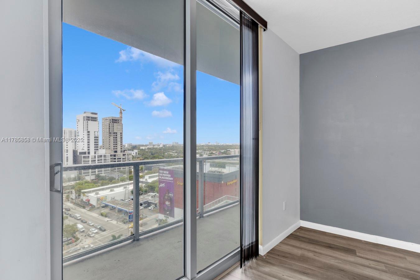 185 Southwest 7th Street, Unit 1508 Miami, FL 33130 - Photo 9 of 30 a view of a glass door with a glass door