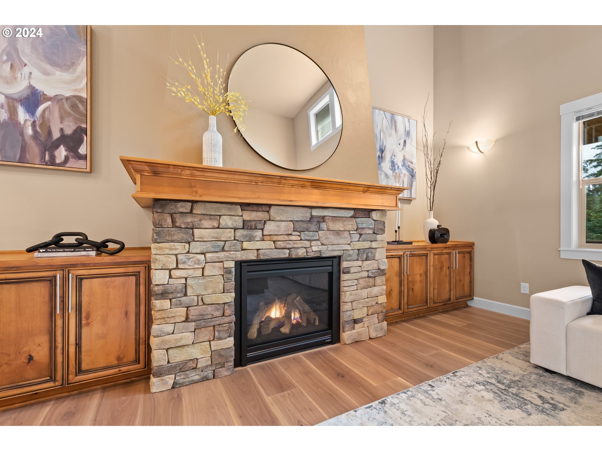 1208 South Great Blue Road Ridgefield, WA 98642 - Photo 15 of 48 a living room with furniture a mirror and a fireplace
